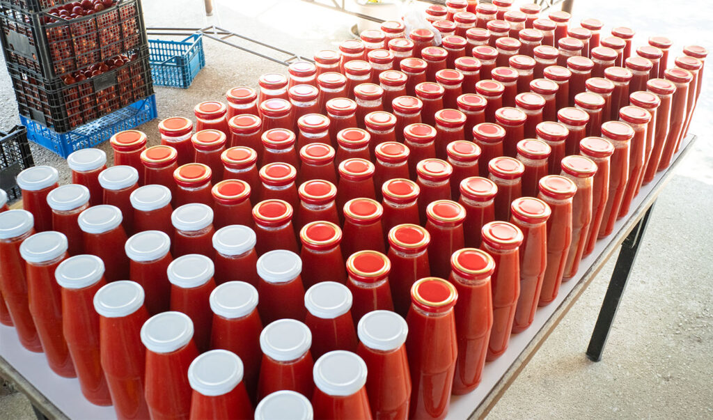 Tomatoes salse bottles ready to be stored